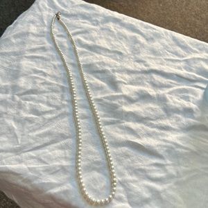 Faux pearl necklace.